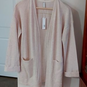 New with tags two pocket sweater with cuff sleeve